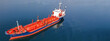 Aerial drone ultra wide top down photo of industrial LPG gas tanker ship anchored in deep blue sea
