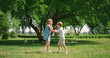 © stockbusters - Children have fun playing active games on nature. Happy family leisure concept.