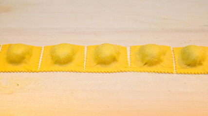 Poster - A closeup shot of the process of making ravioli