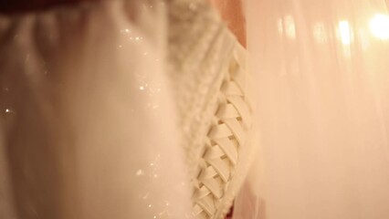 Wall Mural - bride's wedding dress glitters close-up beautiful in sequins