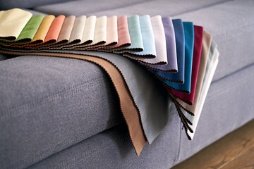 Wall Mural - Colorful upholstery fabric samples on the home sofa