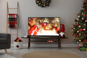 Sticker - Stylish living room interior with modern TV and Christmas decor