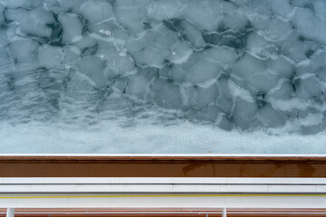 Sticker - A melted glacier in the lake in Alaska during winter