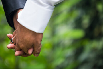 gay couple made up of two men holding hands