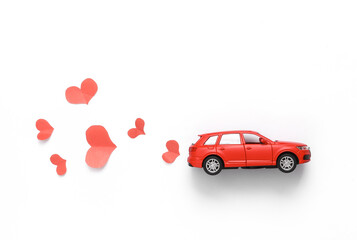 Poster - Romantic, love concept. Car model with hearts on a white background. Top view