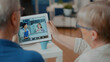© DC Studio - Grandparents using remote videoconference on digital tablet to talk to specialist and little girl about health care. Elder people attending online teleconference on gadget. Close up