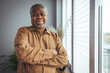 © Dragana Gordic - Portrait of smiling senior african american man at home near window. Portrait Of Happy Senior Man At Home. Happy mature African American man smiling