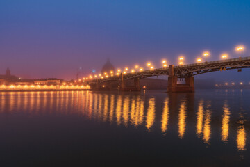 Wall Mural - Garonne river and Dome of the 'Hopital de la Grave' at sunrise in fog in Toulouse, France