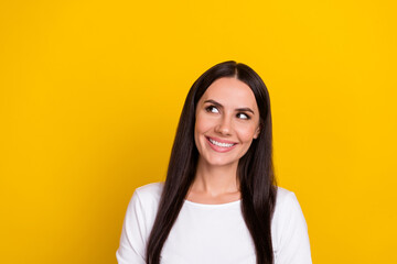 Wall Mural - Photo of young cheerful lady curious interested look empty space idea isolated over yellow color background