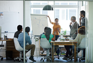 Canvas Print - Im open to all ideas. Shot of a group of coworkers in a boardroom meeting.