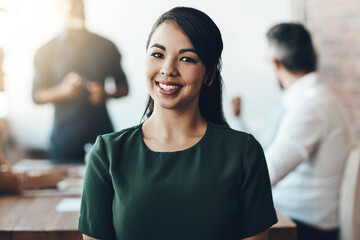 Poster - She puts in the work. Cropped portrait of a young businesswoman sitting in the boardroom during a presentation.