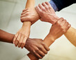 © Arnéll Koegelenberg/peopleimages.com - Strong links create strong teams. Cropped shot of a group of businesspeople linking their arms in solidarity.