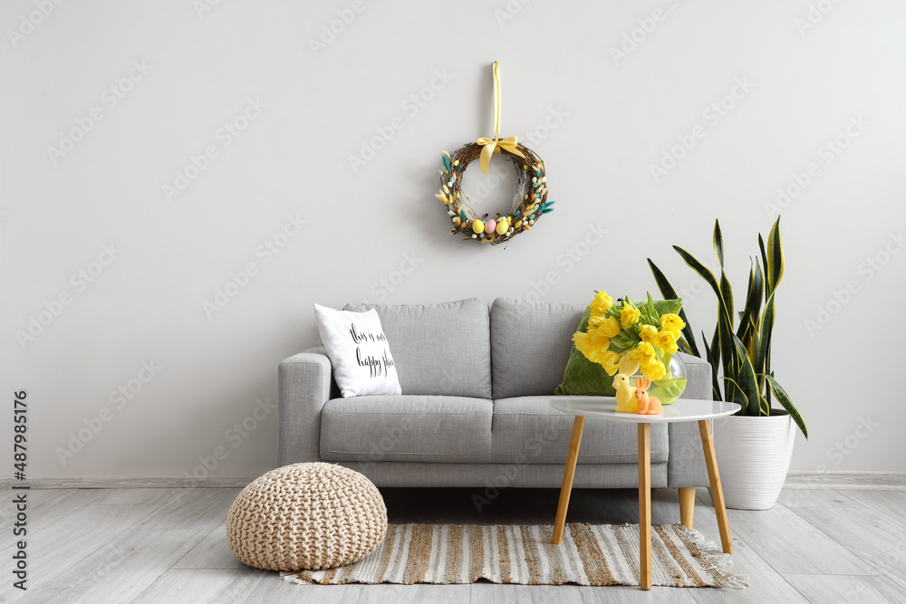 Interior of light living room decorated for Easter celebration