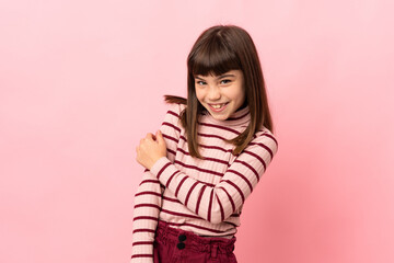 Wall Mural - Little girl isolated on pink background laughing