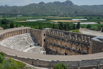 Wall Mural - Roman amphitheater of Aspendos, Belkiz, Ancient theatre of Aspendos in Turkey. Historical destinations concept.