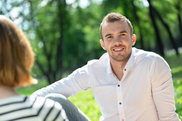 Canvas Print - Couple with a dog in the park