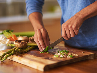 Poster - Cooking thats a cut above the rest. Cropped shot of a man preparing a healthy meal at home.