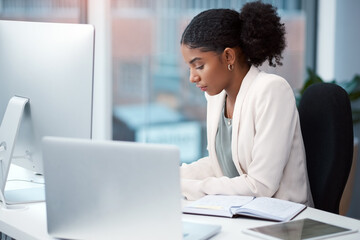 Aufkleber - Nothing sees results like hard work. Shot of a young businesswoman working at her desk in a modern office.