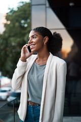 Aufkleber - I just stepped out...can you hear me now. Shot of a young businesswoman using a mobile phone out on the balcony of a modern office.