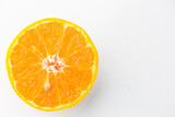 Fototapeta Kuchnia - slice of orange fruit isolated on white background 