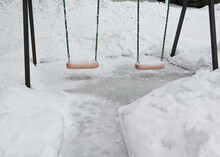 Swing On The Playground In The Yard In Winter