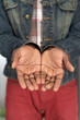 © Svyatoslav Lypynskyy - Begging hands of a poor man concept. Open hands of a young african american man wearing denim jacket. Young african american man with outstretched hands begging for money for life
