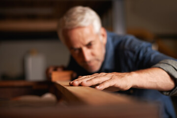 Wall Mural - Your dream job does not exist, you must create it. Cropped shot of a senior man working with wood indoors.