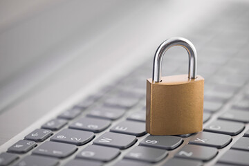 Poster - Security concept with metal padlock on computer keyboard