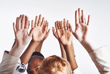 Poster - Be ready to grab opportunity with both hands. Shot of a group of hands reaching up against a white background.