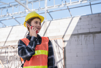 Female civil engineer wear braces smile and talk about project by walkie-talkie.