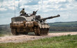 © Martin - British army FV4034 Challenger 2 main battle tank in action on a military exercise, gun barrel targetting sideways, Salisbury Plain Wiltshire UK