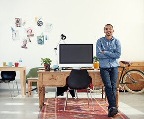 Aufkleber - Lets get to work. Portrait of a casually-dressed young man sitting on his desk in an office.