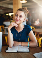 Poster - Remember, the more you learn, the more you earn. Portrait of a young student studying in a cafe.