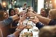 © Mikolette Moller/peopleimages.com - Good food, good friends, good times. Shot of friends having a dinner party at a restaurant.