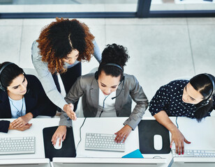 Wall Mural - commitment always shows from every employee on our side. high angle shot of a group of women working