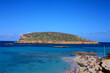 islet of cala conta dipped in the blue of the tourist sea of ​​ibiza in summer
