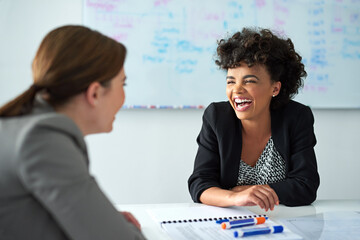 Poster - Theyve got great coworker rapport. Shot of two businesswomen enjoying a meeting together at work.