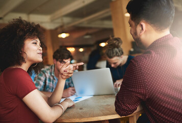 Wall Mural - They just get each other. Shot of students studying in a coffee shop.