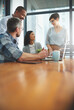 © Delmaine Donson/peopleimages.com - Working together to get the task done. Shot of businesspeople working together in the office.