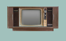 Vintage TV In Wooden Cabinet. Retro TV In Wooden Cabinet. Old Retro TV Set In Wooden Cabinet On Isolated Green Background With Clipping Path.