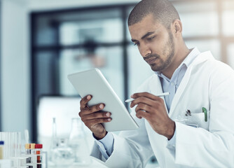 Aufkleber - Entering data into the information system. Shot of a scientist recording his findings on a digital tablet.