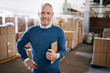 Aufkleber - Tracking your shipment from start to finish. Portrait of a mature man standing in a distribution warehouse.