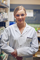 Poster - She has a compassionate, helpful attitude. Shot of an attractive young woman working in a pharmacy.