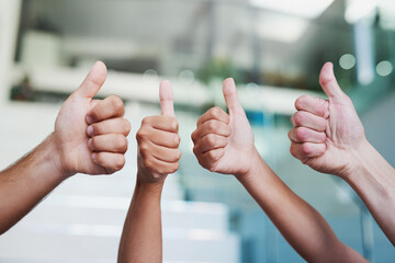 Poster - 100 approved. Cropped shot of a group of hands showing thumbs up in an office.