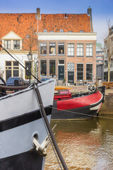 Wall Mural - Bow of a ship in front of a typical dutch house in Zwolle, Netherlands