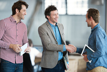 Poster - Youve done a great job. Shot of two coworkers shaking hands in an office.