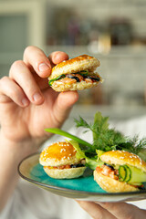 Wall Mural - hand holding a plate with a salad