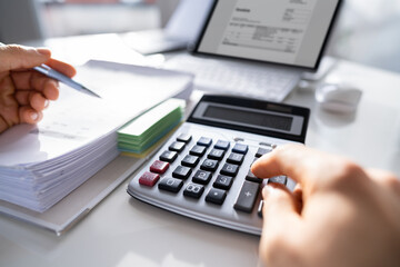 Accountant Calculating Finance Budget And Tax Invoice