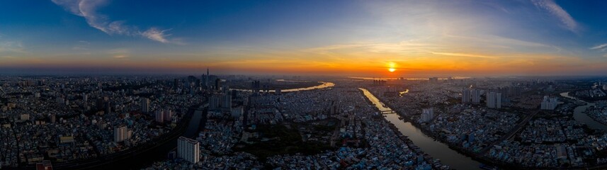 HO CHI MINH city, VIETNAM - Feb 2022 aerial view of Ho Chi Minh city skyline look from District 4 toward the downtown during sunrise Tet Holiday