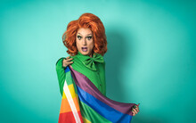 Drag Queen Celebrating Gay Pride Holding Rainbow Flag - LGBTQ Social Community Concept